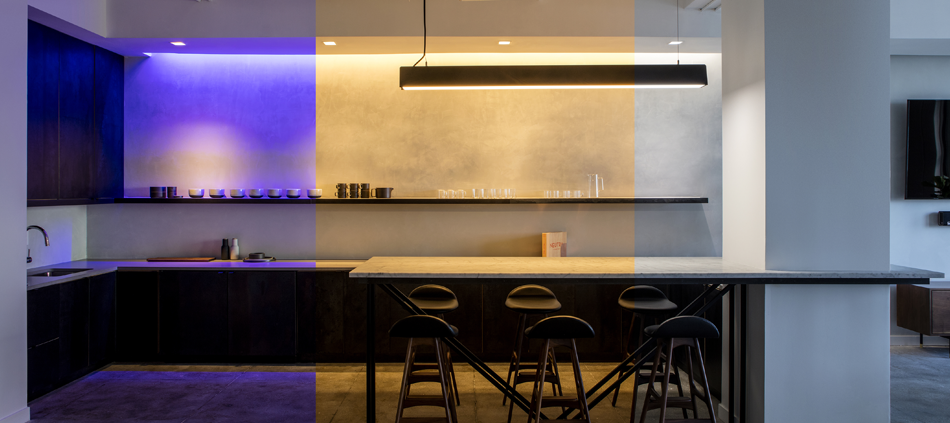 Purple light, warm white light, and brighter white light shown side by side in Ketra's NYC Showroom